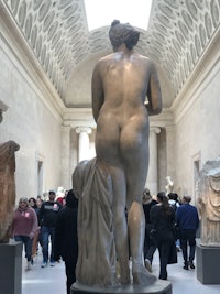 a statue of a woman in a museum