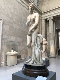 a statue of a woman in a museum
