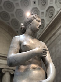 a statue of a woman in a museum